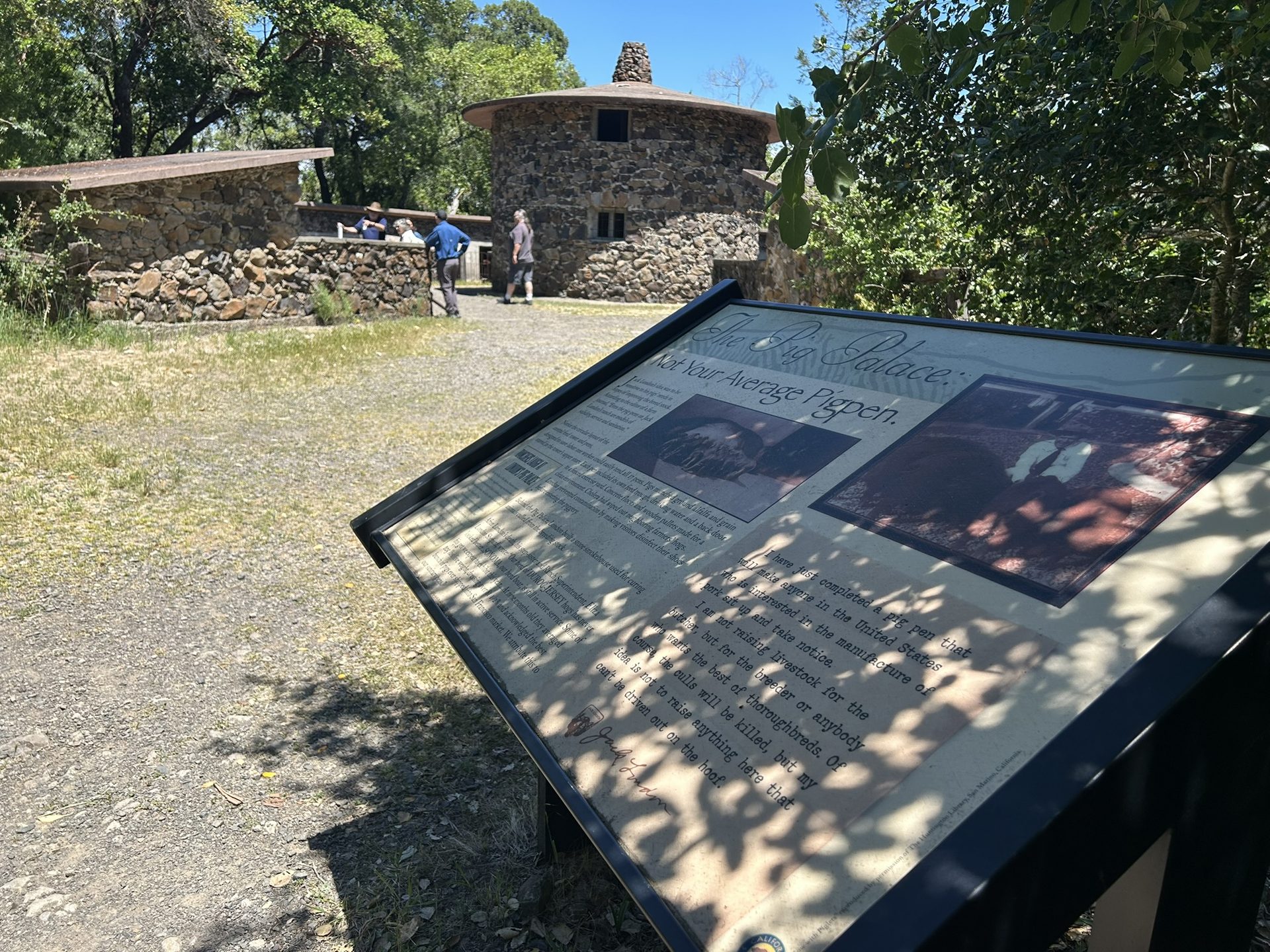 The Pig Palace interpretive sign and circular stone structure