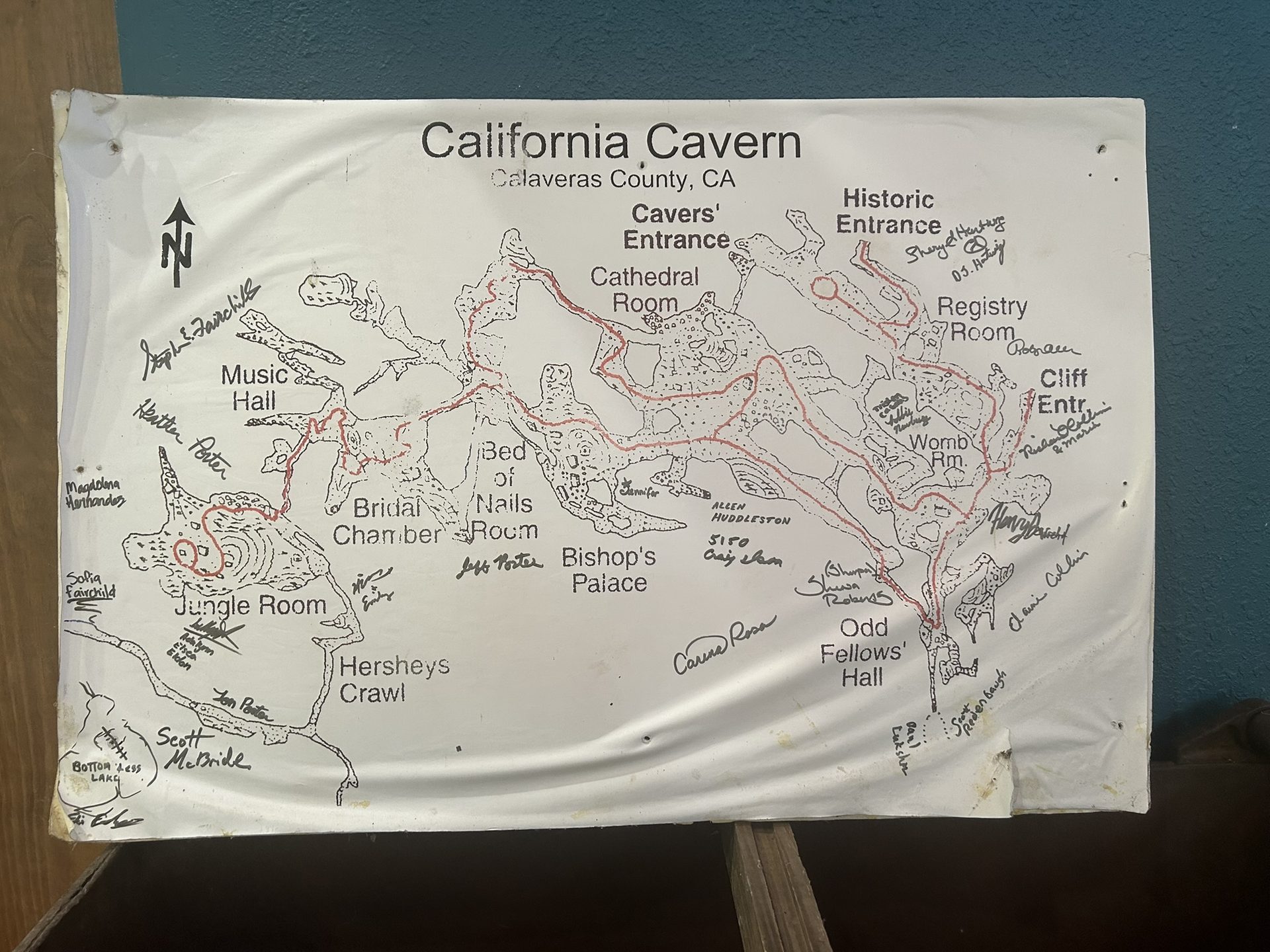 Hand-drawn California Cavern map covered in signatures