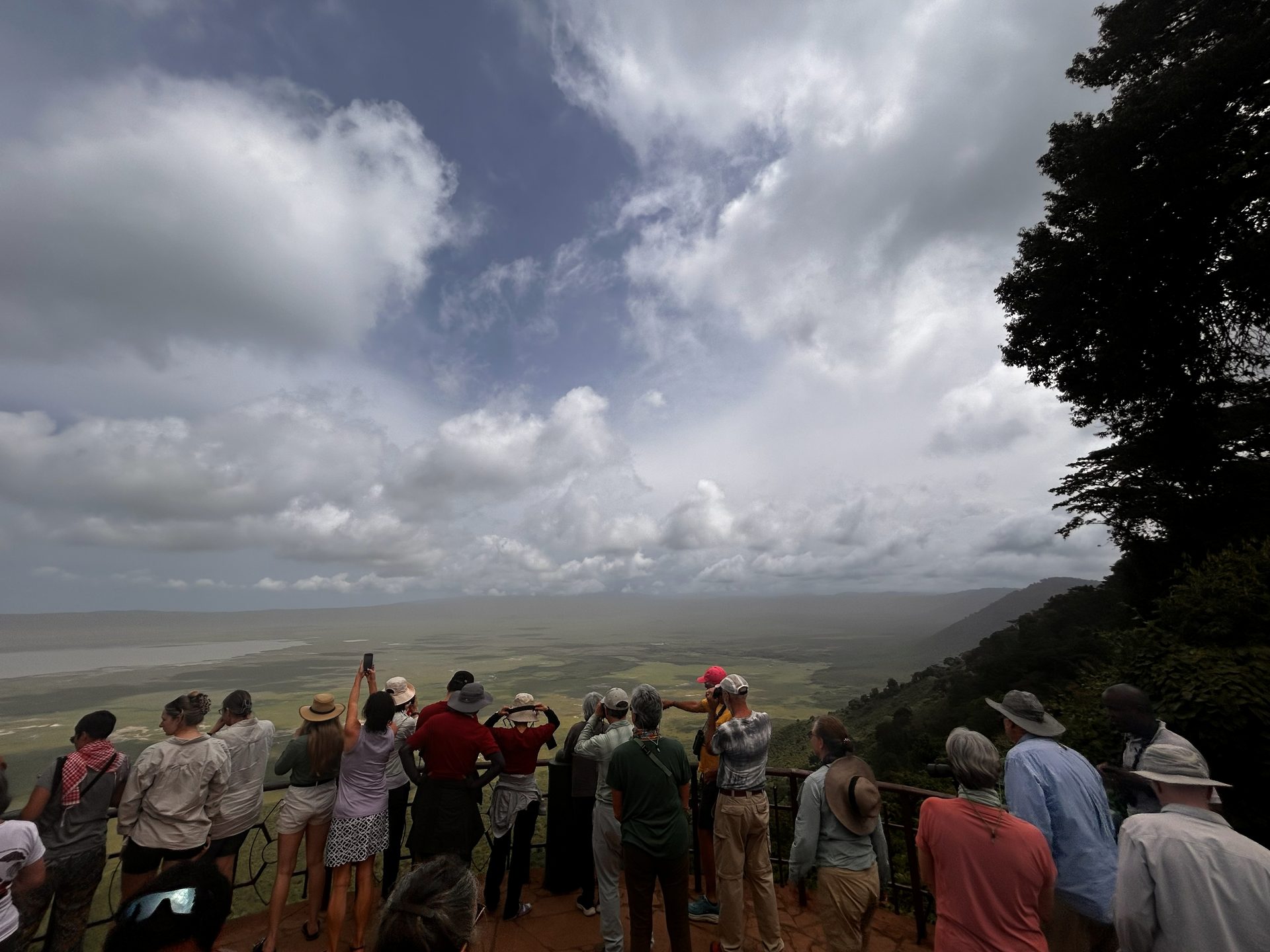 The group at the Ngorongoro Crater rim overlook — everyone photographing the vast crater floor below